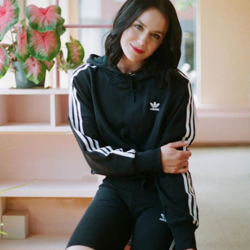 Woman in Adidas tracksuit