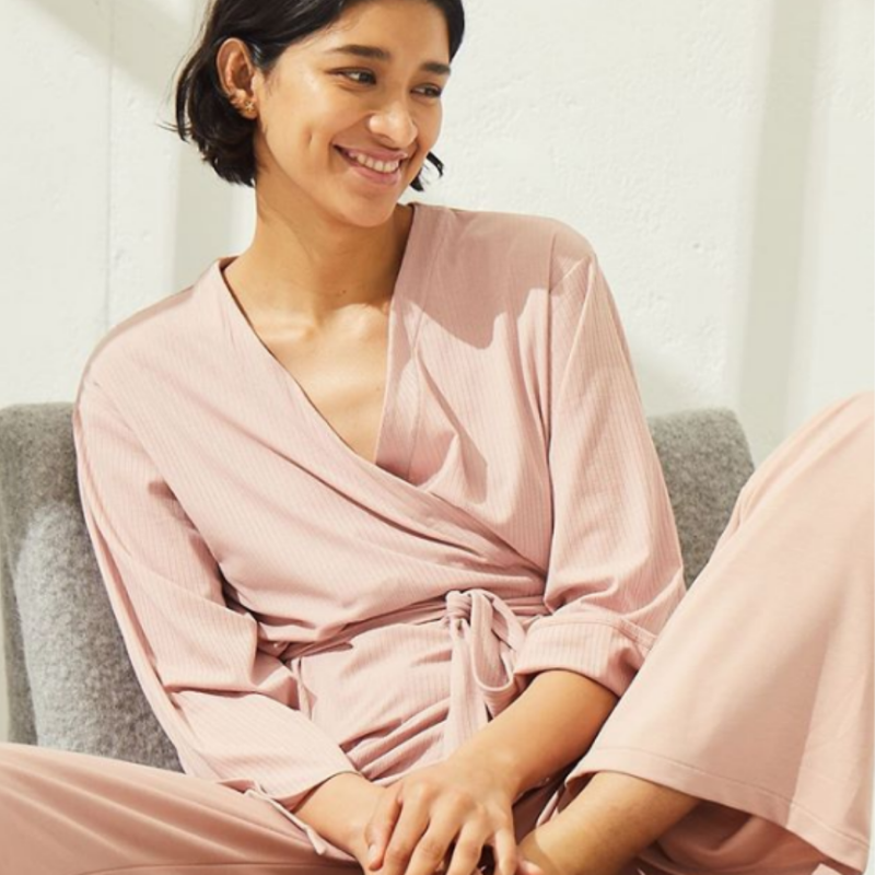 Woman in light pink wrap top